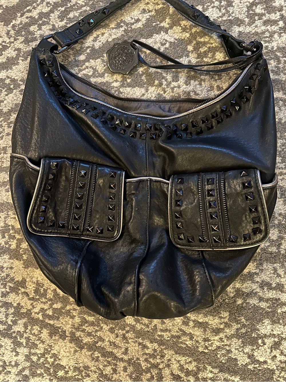Vince Camuto Beautiful Leather Bag
With studs & silver piping detail.